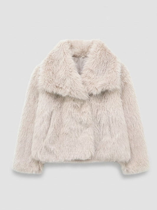 A light beige faux fur jacket with a wide collar, displayed against a neutral light gray background.